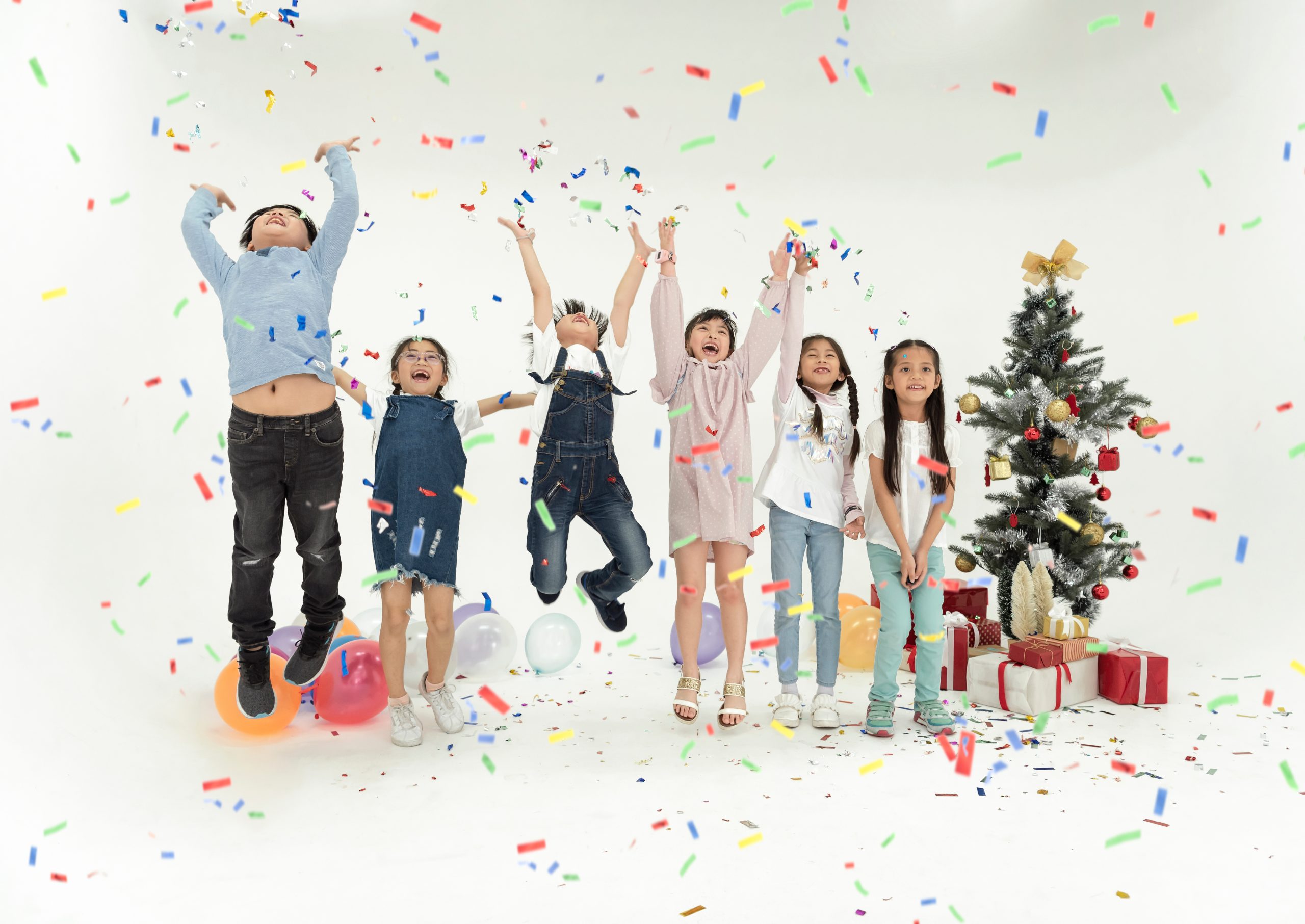 Group of kids celebrate christmas and happy new year party together.